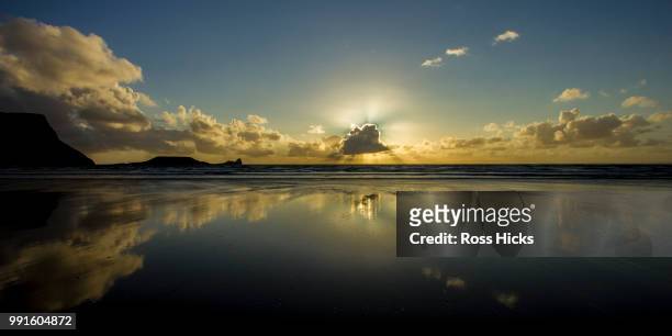 rhossili sunset, gower peninsula - rhossili stock pictures, royalty-free photos & images