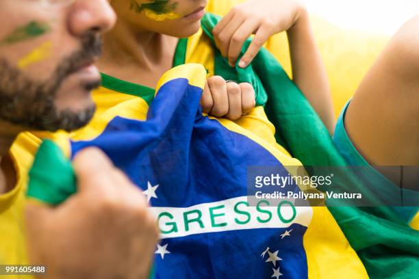 brazilian supporters - brazil body paint stock pictures, royalty-free photos & images