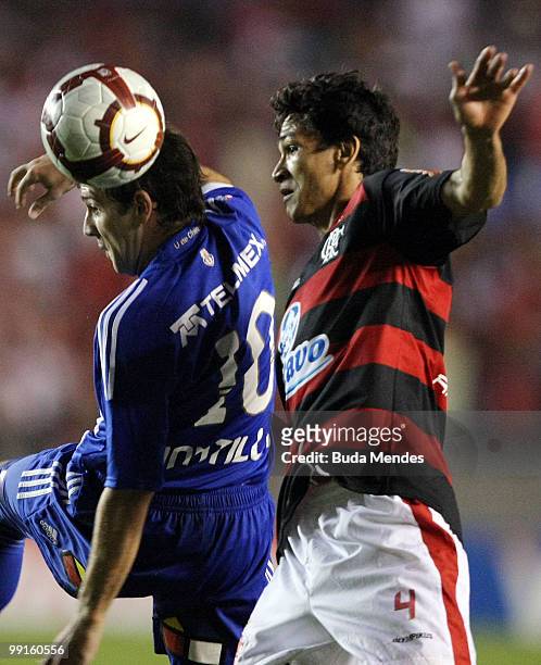 Ronaldo Angelim of Flamengo fights for the ball with Walter Montillo of Universidad de Chile during a match as part of Libertadores Cup at Maracana...