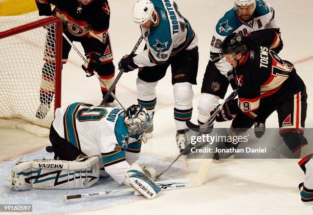 Evgeni Nabokov of the San Jose Sharks stops a shot by Jonathan Toews of the Chicago Blackhawks at the United Center on December 22, 2009 in Chicago,...