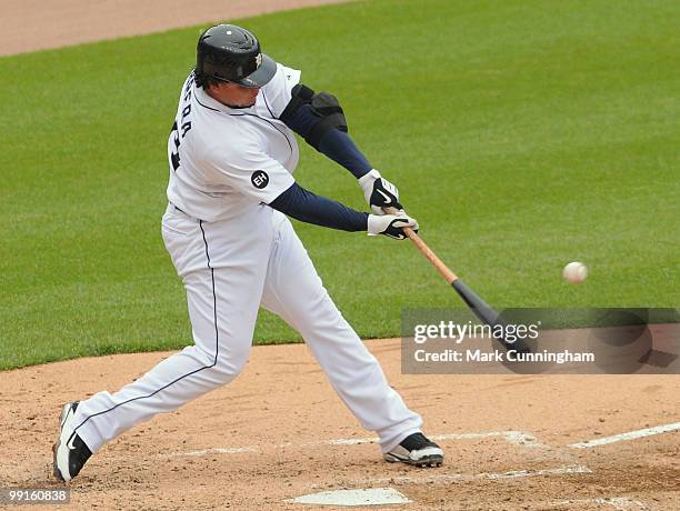 Miguel Cabrera of the Detroit Tigers hits a single in the sixth inning of the first game of a double header against the New York Yankees at Comerica...