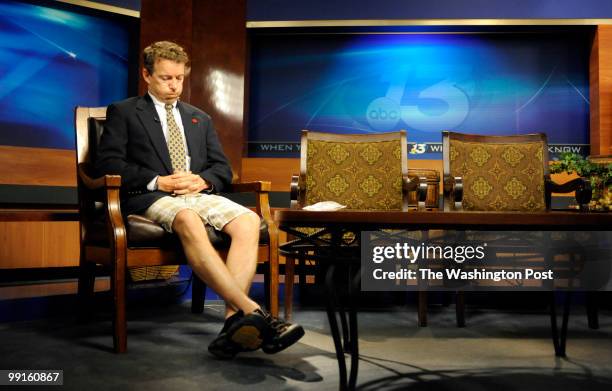 Dressed in half a suite after running from his son's soccer game, Dr. Rand Paul waits to be a guest on a Fox News program May 5 in Bowling Green,...