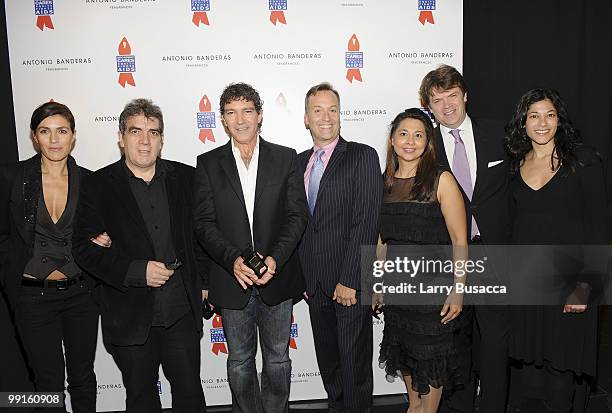 Valerie Schaack, Eduardo Lago, Antonio Banderas, Frank Conway, Vanita Sabnani, Didier Mainedebiren and Ambika Kumar pose while Antonio Banderas...