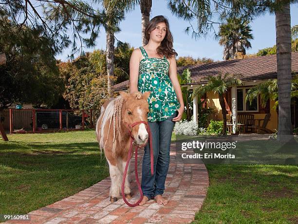 teenage girl with mini horse - miniature horse stock pictures, royalty-free photos & images