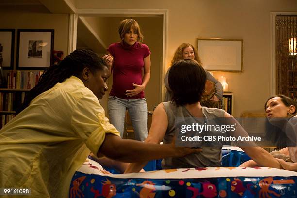In background, wearing red, Jennifer Lopez as Zoe and to her left, Melissa McCarthy as Carol in CBS Films' "The Back-up Plan."