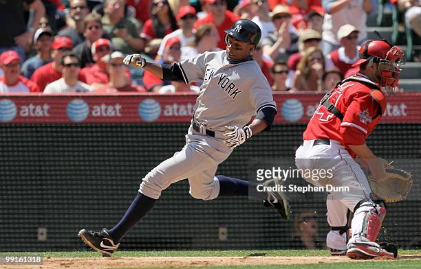 Curtis Granderson of the New York Yankees scores a run against the Los Angeles Angels of Anaheim on April 24, 2010 at Angel Stadium in Anaheim,...
