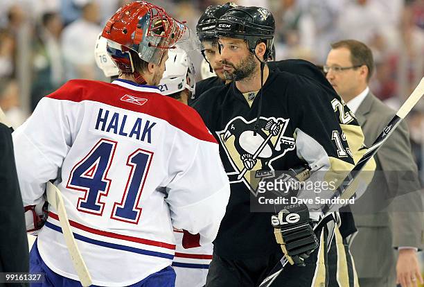Jaroslav Halak of the Montreal Canadiens shakes hands with Bill Guerin of the Pittsburgh Penguins in Game Seven of the Eastern Conference Semifinals...