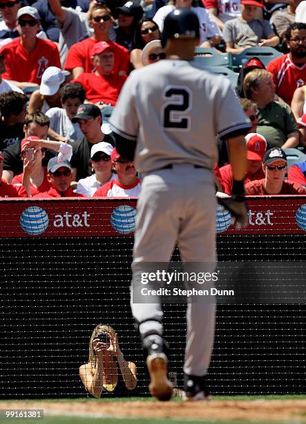 Female fan takes a picture of Derek Jeter of the New York Yankees as he bats against the Los Angeles Angels of Anaheim on April 24, 2010 at Angel...