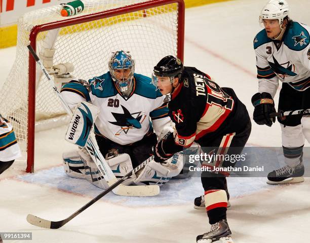 Jonathan Toews of the Chicago Blackhawks shots the puck past Evgeni Nabokov of the San Jose Sharks at the United Center on December 22, 2009 in...