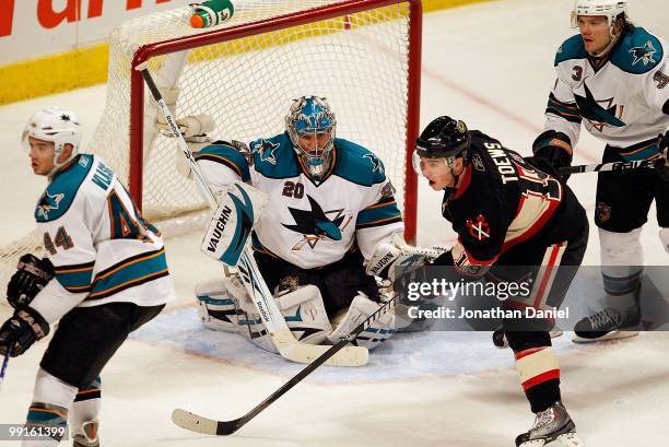 Jonathan Toews of the Chicago Blackhawks shots the puck past Evgeni Nabokov of the San Jose Sharks at the United Center on December 22, 2009 in...