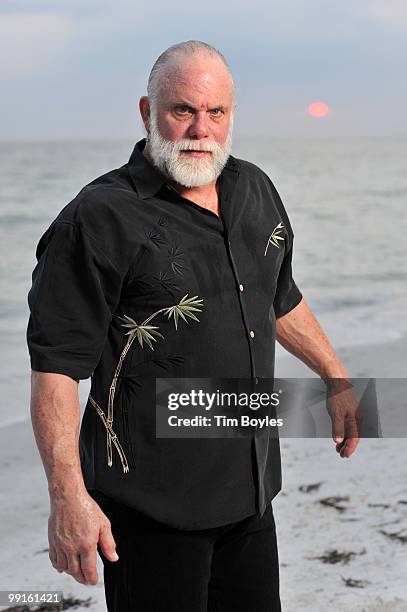 Randy Poffo , known by his ring name "Macho Man" Randy Savage, poses for a photograph following his wedding to Lynn Payne on the beach May 10, 2010...