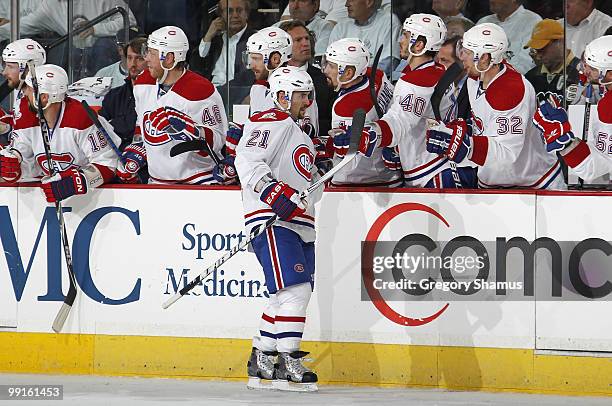 Brian Gionta of the Montreal Canadiens celebrates his goal with the bench against the Pittsburgh Penguins in Game Seven of the Eastern Conference...