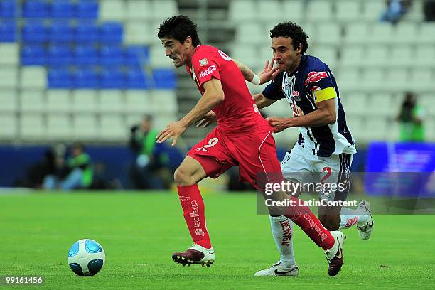 Leobardo Lopez of Pachuca fights for the ball with Hector Mancilla of Toluca during a semifinal match as part of the 2010 Bicentenary Tournament at...