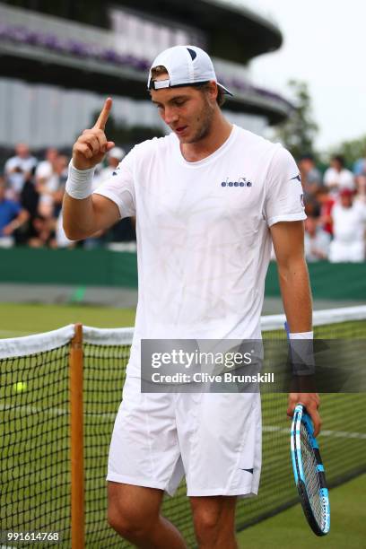 Jan-Lennard Struff of Germany celebrates his victory over Ivo Karlovic of Croatia after their Men's Singles second round match on day three of the...