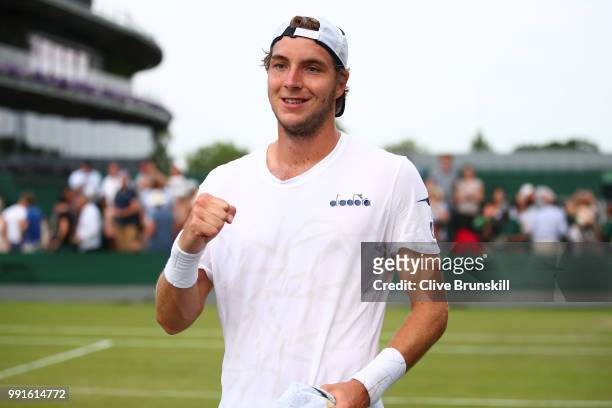 Jan-Lennard Struff of Germany celebrates his victory over Ivo Karlovic of Croatia after their Men's Singles second round match on day three of the...
