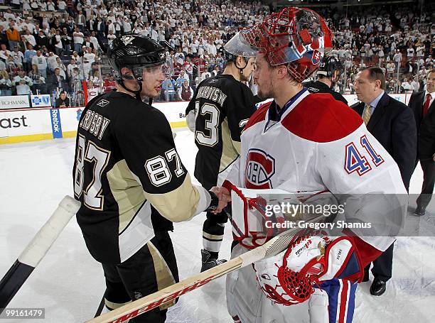 Sidney Crosby of the Pittsburgh Penguins shakes hands with Jaroslav Halak of the Montreal Canadiens after a 5-2 Canadiens victory in Game Seven of...