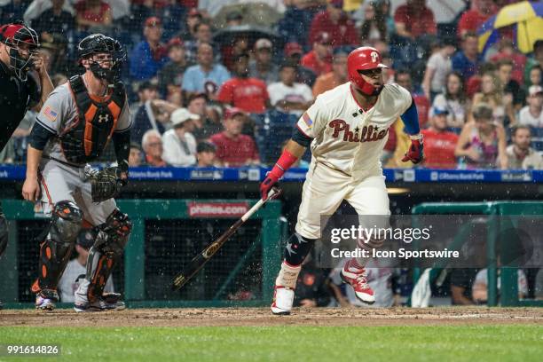 Philadelphia Phillies First base Carlos Santana runs to first base in the second inning during an MLB game between the Baltimore Orioles and...