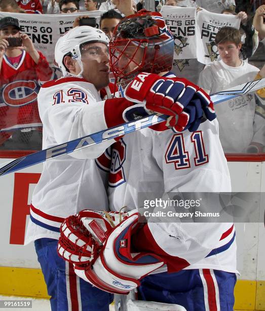 Jaroslav Halak of the Montreal Canadiens is congratulated by Michael Cammalleri after a 5-2 victory over the Pittsburgh Penguins in Game Seven of the...