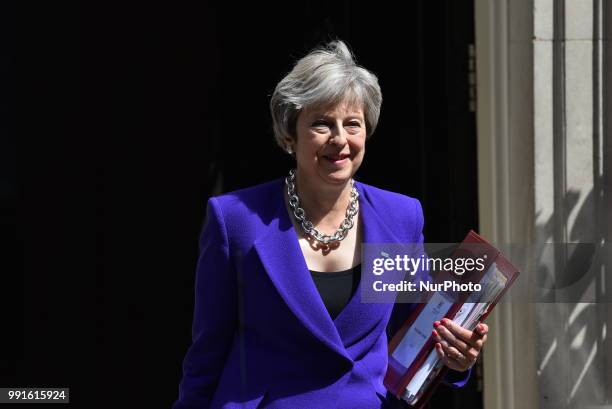 British Prime Minister Theresa May leaves 10 Downing Street to makes her way to the Parliament as she attends Prime Minister Questions session ,...