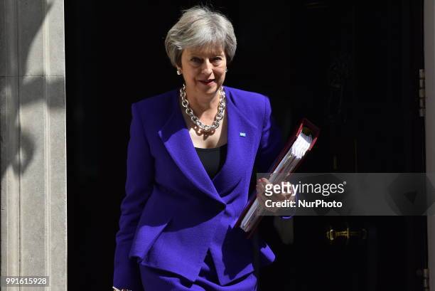 British Prime Minister Theresa May leaves 10 Downing Street to makes her way to the Parliament as she attends Prime Minister Questions session ,...