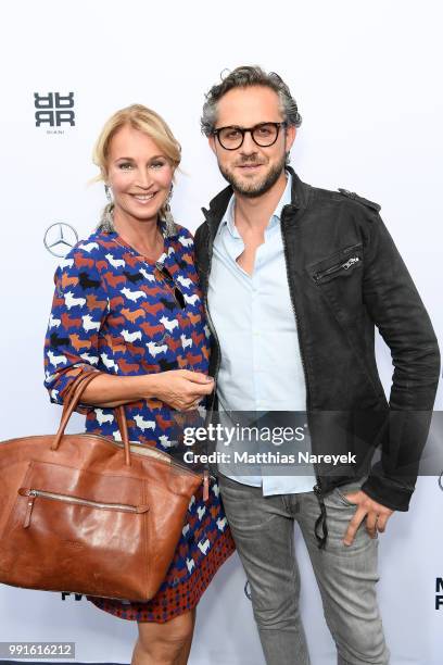 Caroline Beil and Philipp Sattler attend the Riani show during the Berlin Fashion Week Spring/Summer 2019 at ewerk on July 4, 2018 in Berlin, Germany.