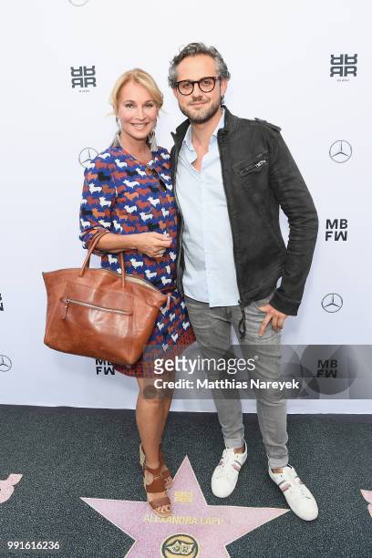 Caroline Beil and Philipp Sattler attend the Riani show during the Berlin Fashion Week Spring/Summer 2019 at ewerk on July 4, 2018 in Berlin, Germany.