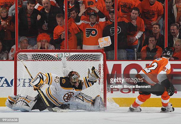 Tuukka Rask of the Boston Bruins stops Ville Leino of the Philadelphia Flyers on a penalty shot in Game Six of the Eastern Conference Semifinals...
