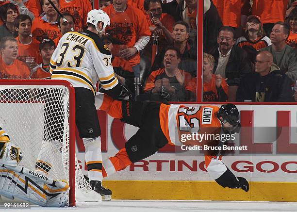 Zdeno Chara of the Boston Bruins hits Ville Leino of the Philadelphia Flyers in Game Six of the Eastern Conference Semifinals during the 2010 NHL...