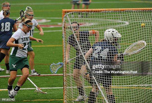 St. Stephen's & St. Agnes' Kelsey Horton drops her stick after scoring a goal past Georgetown Visitation goalie Gen Giblin, right, during the first...