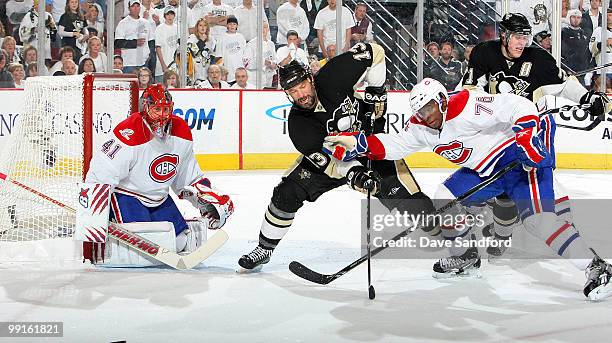 Bill Guerin of the Pittsburgh Penguins battles with PK Subban of the Montreal Canadiens as Jaroslav Halak of the Montreal Canadiens keeps an eye on...