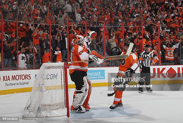 Goaltender Michael Leighton and Kimmo Timonen of the Philadelphia Flyers celebrate their victory over the Boston Bruins in Game Six of the Eastern...