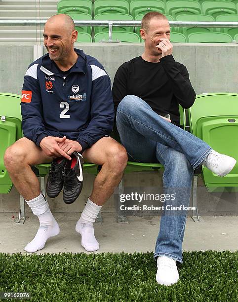 Kevin Muscat of the Victory talks with Socceroo Craig Moore after a Melbourne Victory A-League training session at AAMI Park on May 13, 2010 in...