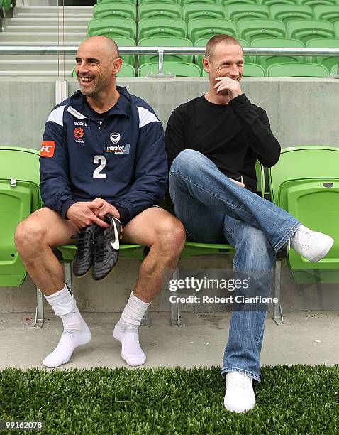 Kevin Muscat of the Victory talks with Socceroo Craig Moore after a Melbourne Victory A-League training session at AAMI Park on May 13, 2010 in...