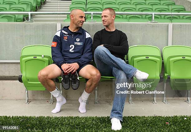 Kevin Muscat of the Victory talks with Socceroo Craig Moore after a Melbourne Victory A-League training session at AAMI Park on May 13, 2010 in...