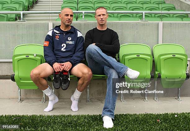 Kevin Muscat of the Victory talks with Socceroo Craig Moore after a Melbourne Victory A-League training session at AAMI Park on May 13, 2010 in...
