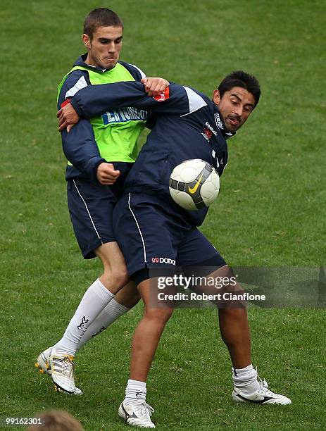 Carlos Hernandez of the Victory is challanged by his teammate during a Melbourne Victory A-League training session at AAMI Park on May 13, 2010 in...