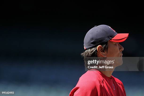 Hideki Matsui of the Los Angeles Angels of Anaheim looks on during batting practice prior to the start of the game against the Tampa Bay Rays at...