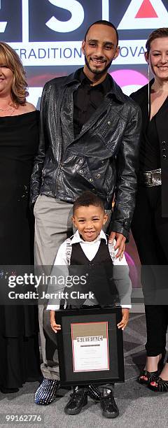 Swizz Beatz and his son Kasseem Dean, Jr. Pose for a photo with SESAC Executives at the 2010 SESAC New York Music Awards at the IAC Building on May...