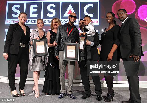 Swizz Beatz and his son Kasseem Dean, Jr. Pose for a photo with SESAC Executives at the 2010 SESAC New York Music Awards at the IAC Building on May...