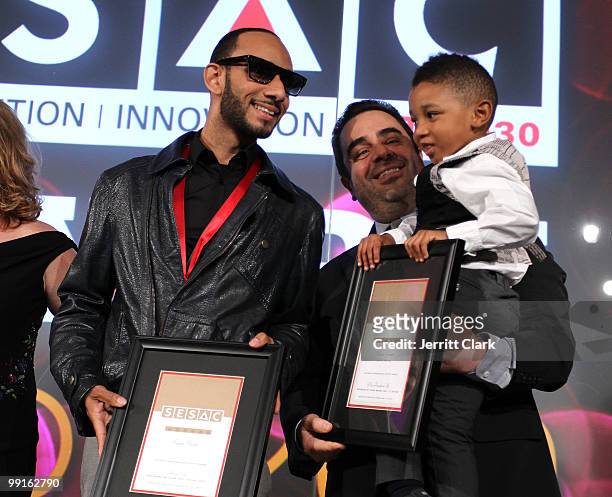Swizz Beatz and his son Kasseem Dean, Jr. Pose for a photo with SESAC Executives at the 2010 SESAC New York Music Awards at the IAC Building on May...