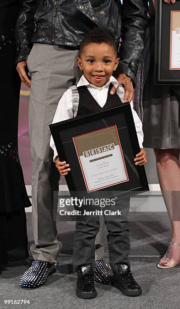 Kasseem Dean, Jr. Poses on stage with his father Swizz Beatz at the 2010 SESAC New York Music Awards at the IAC Building on May 12, 2010 in New York...