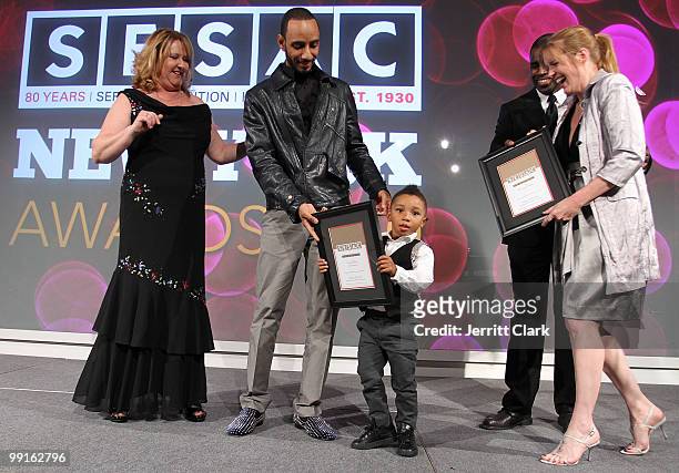 Swizz Beatz is joined by his son Kasseem Dean, Jr. On stage after receiving and award at the 2010 SESAC New York Music Awards at the IAC Building on...