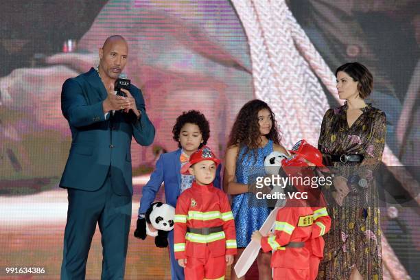 Actor Dwayne Johnson and actress Neve Campbell attend 'Skyscraper' premiere on July 2, 2018 in Beijing, China.