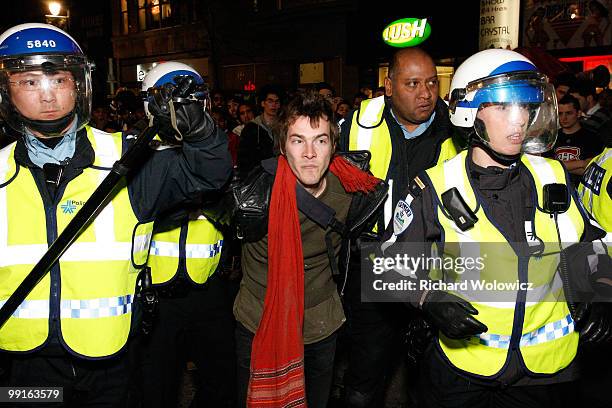 Montreal police arrest a fan in downtown Montreal after the Montreal Canadiens defeated the Pittsburgh Penguins in Game Seven of the Eastern...