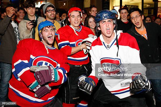 Montreal Canadiens fans celebrate the defeat of the Pittsburgh Penguins in Game Seven of the Eastern Conference Semifinals during the 2010 NHL...