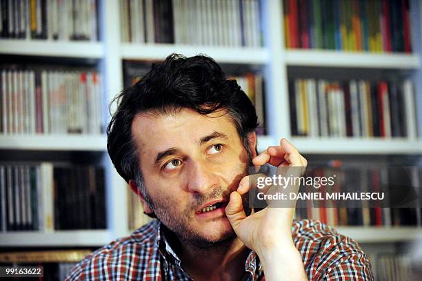Romanian film director Cristi Puiu gestures during an interview with AFP in this photo taken in Bucharest on May 9, 2010. Puiu's new film "Aurora"...