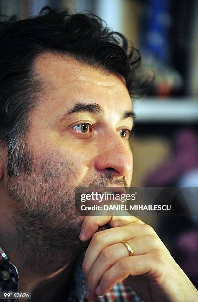 Romanian film director Cristi Puiu gestures during an interview with AFP in this photo taken in Bucharest on May 9, 2010. Puiu's new film "Aurora"...