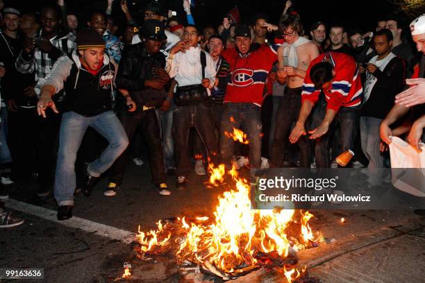 Canadiens fans celebrate the Montreal Canadiens defeat of the Pittsburgh Penguins in Game Seven of the Eastern Conference Semifinals during the 2010...