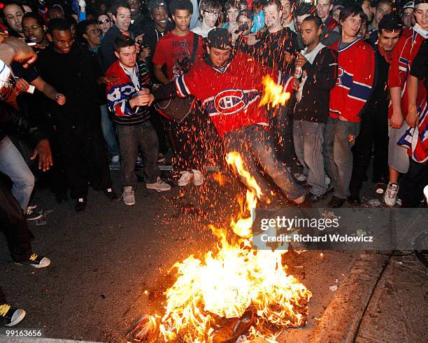 Canadiens fans celebrate the Montreal Canadiens defeat of the Pittsburgh Penguins in Game Seven of the Eastern Conference Semifinals during the 2010...