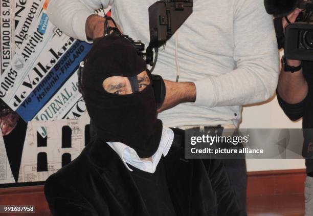 Gaspare Mutolo, former Sicilian mafioso and drug dealer wears a black mask and sits in front of media representatives in Rome, Italy, 17 November...